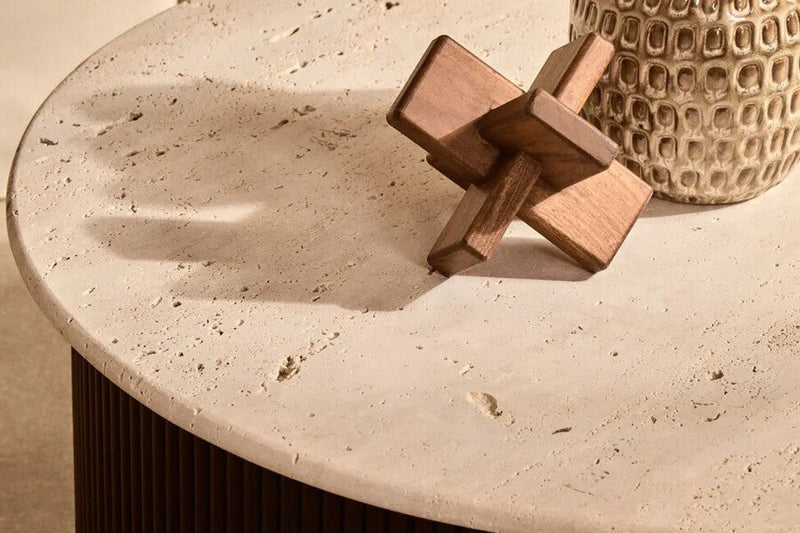 Layered bands of linen, velvet, rattan weave, veined marble, walnut grain and wool in warm neutral tones