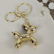 Load image into Gallery viewer, Gold Balloon Dog Keyring