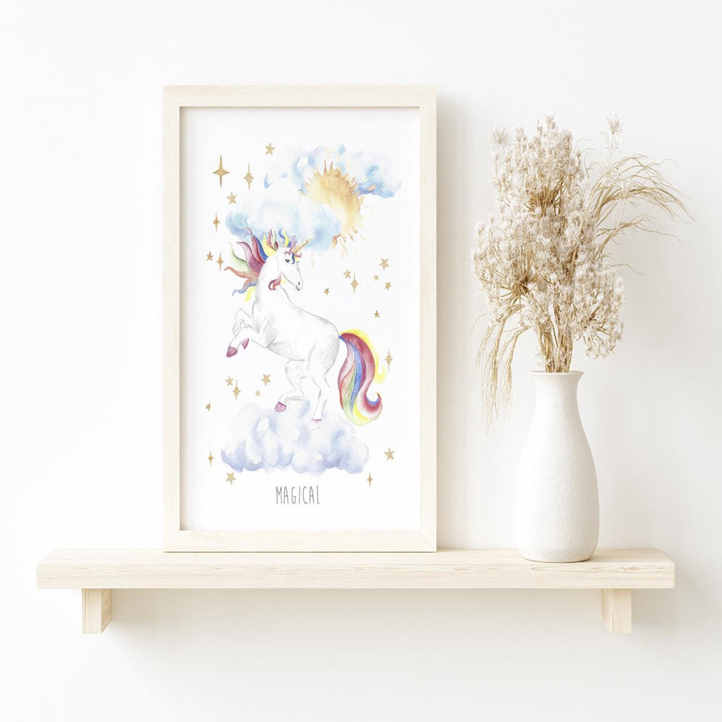 Framed unicorn print on a shelf with a vase of dried flowers.
