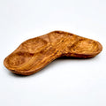 Wooden bowl with a natural, curved design on a white background